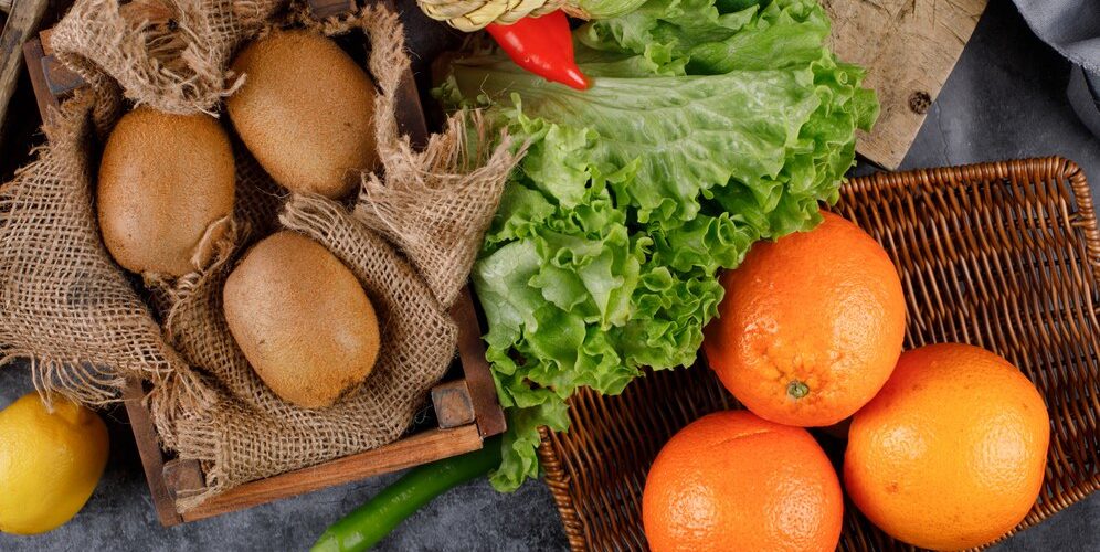 kiwies-oranges-rustic-wooden-trays_114579-5952